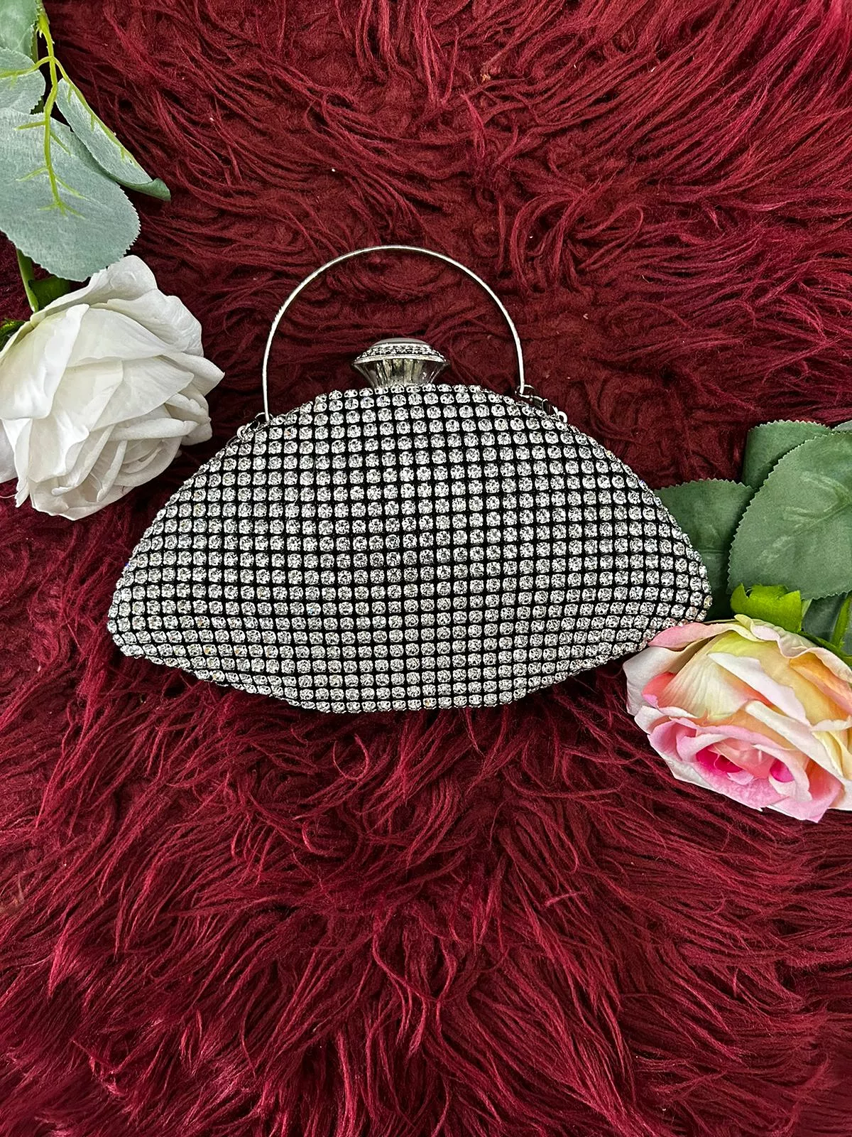 Oval shaped clutch bag